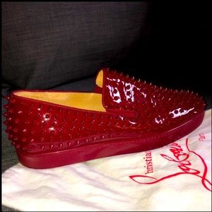 CHRISTIAN LOUBOUTIN 
Roller Boat spike-embellished